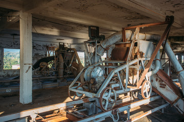 Rusty cart in old abandoned silo elevator in Eshera, Abkhazia
