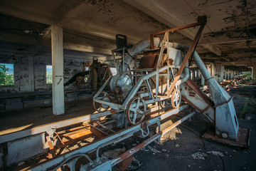 Rusty cart in old abandoned silo elevator in Eshera, Abkhazia