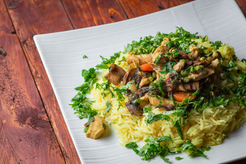 Plate of tasty rice with chicken meat