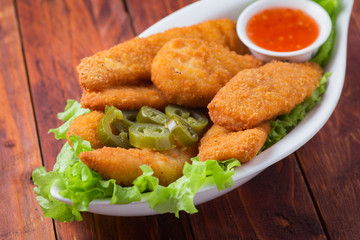Delicious chicken nuggets with jalapeno and ketchup