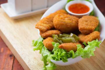 Delicious chicken nuggets with jalapeno and ketchup