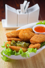 Delicious chicken nuggets with jalapeno and ketchup