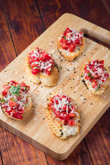 Canape on wooden background