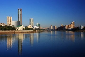 Fototapeta na wymiar Buildings of the city of Yekaterinburg on the river bank