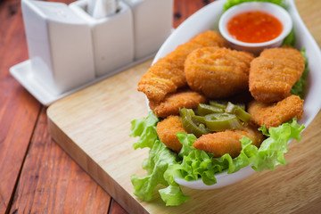 Delicious chicken nuggets with jalapeno and ketchup