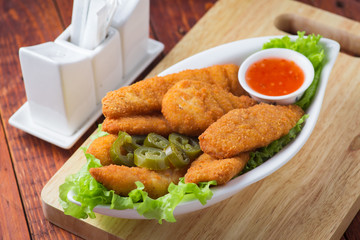 Delicious chicken nuggets with jalapeno and ketchup