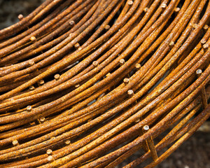 Steel rods or bars used to reinforce concrete.