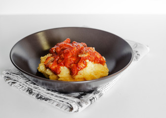 Polenta with tomato mushroom sauce