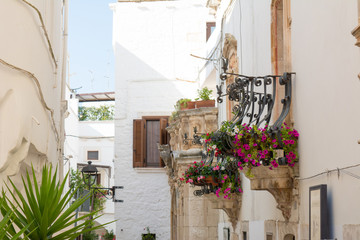 Some White and Traditional Buildings in the City of Locorotondo, in Italy, in Summer