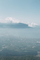 Vesuvius volcano in Italy. Top of the mountain, view of the crater and the surrounding area. High view, Naples and Pompeii below. The nature around the volcano