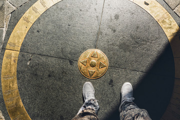 Foot selfie Bratislava kilometer Zero at St. Michael's gate. Slovakia