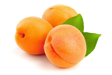 Apricot fruits with leaves isolated on white background macro