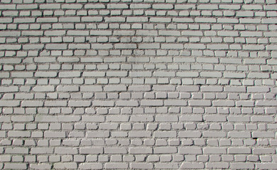 brick white wall textured and with a clear pattern of light