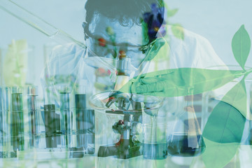 Double exposure scientist in laboratory to research with test tube , science concept.