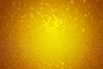 Gold sparkle rays lights with bokeh elegant show on stage abstract background. Dust sparks background.