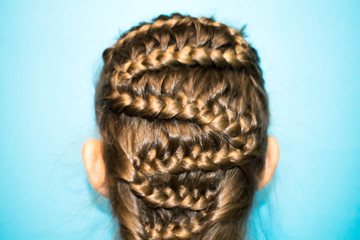 hair long light blond braids pigtails braided in the form of a snake hairdresser's hairdo to design the background