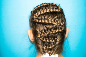 hair long light blond braids pigtails braided in the form of a snake hairdresser's hairdo to design the background