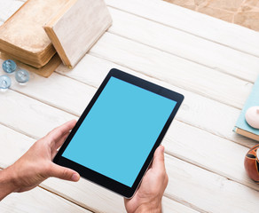 Digital tablet computer in male hands