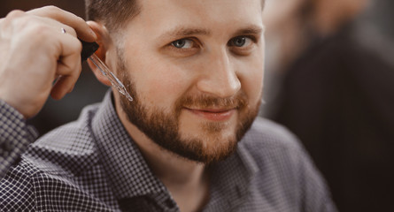 Barbershop handsome man pipette with beard care product oil
