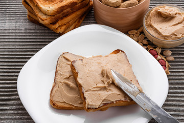 peanut paste on a wooden rustic background