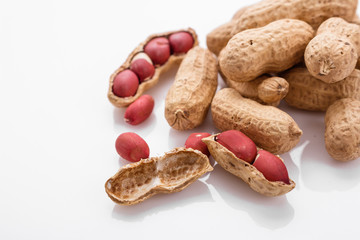 fresh peanuts on a white acrylic background