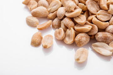 fresh peanuts on a white acrylic background