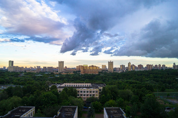 Naklejka na ściany i meble Summer panoramic view. Dramatic stormy sky over the environmentally friendly comfortable residential district in Moscow.