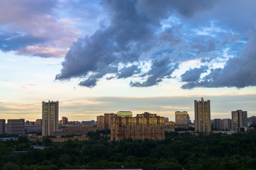 Fototapeta premium Summer panoramic view. Dramatic stormy sky over the environmentally friendly comfortable residential district in Moscow.