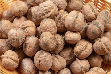 Close up of several walnuts in a basket 