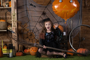 girl in a halloween witch costume