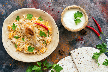 Bombay biryani on a rustic background with spices, Traditional spicy indian food, Iftar meal. Top view,flat lay.