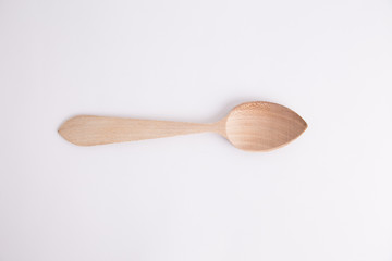 wooden spoon in color background