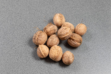 Some walnuts lying on a table in the kitchen 