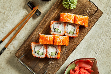 Sushi served with wasabi, ginger and soy sauce