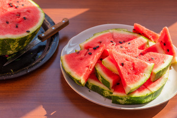 Fresh sliced watermelon on a plate close-up - top view