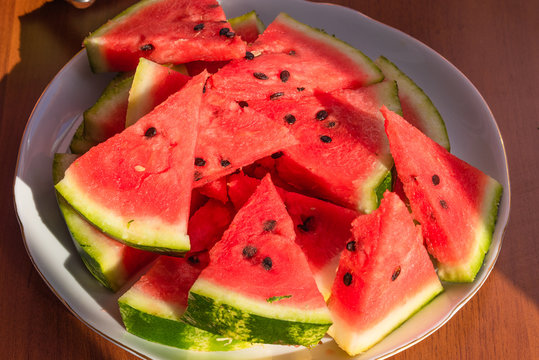 Fresh sliced watermelon on a plate close-up - top view