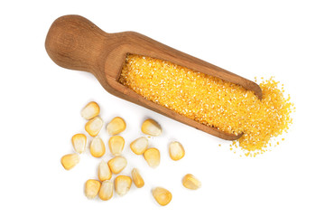 corn groats or cornmeal in wooden scoop isolated on white background. Top view. Flat lay