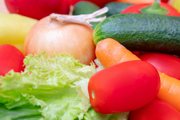 Vegetables: lettuce, onions, tomatoes, cucumbers, onions, carrots, red sweet peppers.