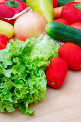Vegetables: lettuce, onions, tomatoes, cucumbers, onions, carrots, red sweet peppers.
