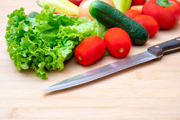 Vegetables: lettuce, onions, tomatoes, cucumbers, onions, carrots, red sweet peppers.