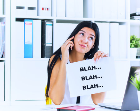 Young businesswoman in the process of useless conversation with the client or boss. Effective communication concept.
