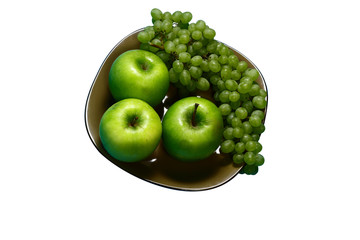 Still life of fruit on a beautiful plate.