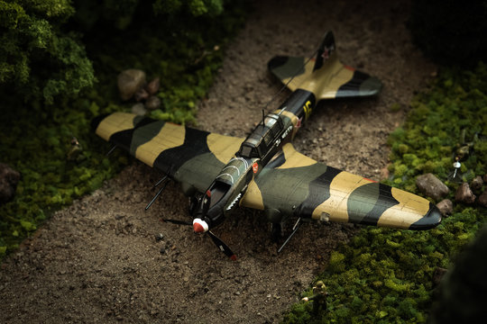 Model of airplane IL-2 with soldiers in diorama