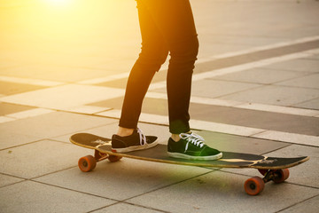 Fototapeta na wymiar Cropped photo of young woman with skateboard.
