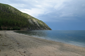 Fototapeta na wymiar Picturesque long sandy beach. Dry Bay. Lake Baikal