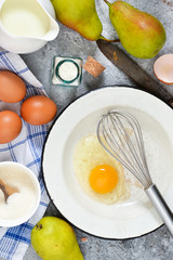 Ingredients for pie with pears. The process of making sweet pastries. Ingredients for baking.