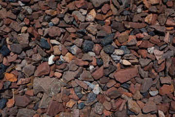 natural background of wet pebbles on the lake shore