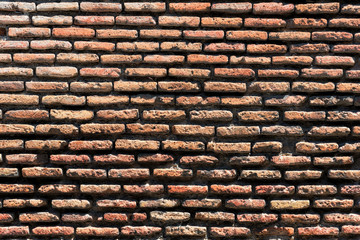 Cracked Dark Red Old Brick Wall Texture. Damaged Brown Abstract Blank Stonewall Background.