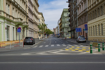 Fototapeta premium Prague, Cz, 22.07.2018: A wide street of a European city with several cars and people