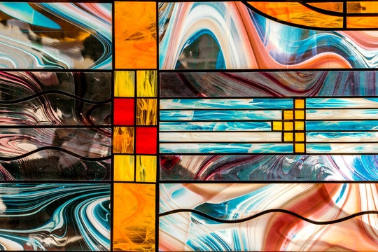 image of a multicolored stained glass window with an irregular block pattern, an abstract pattern on the glass, a trend, a multicolored geometric background